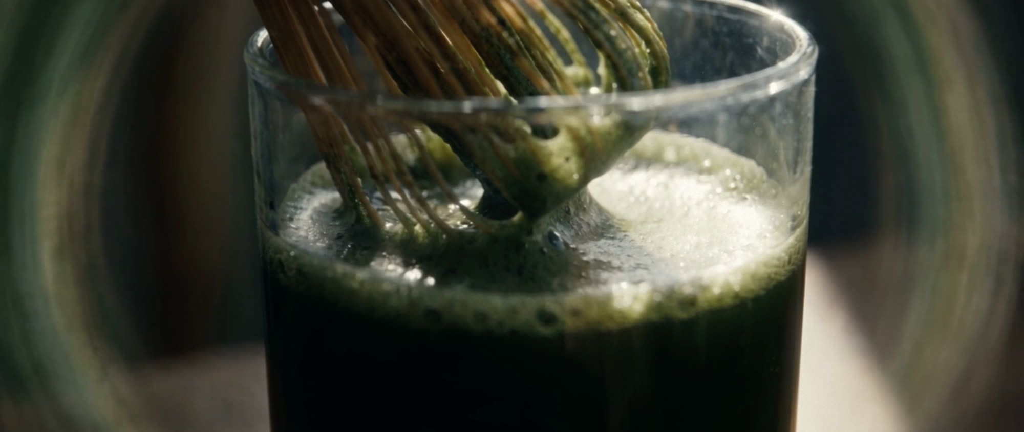 Quest — frame from the film, a glass of matcha